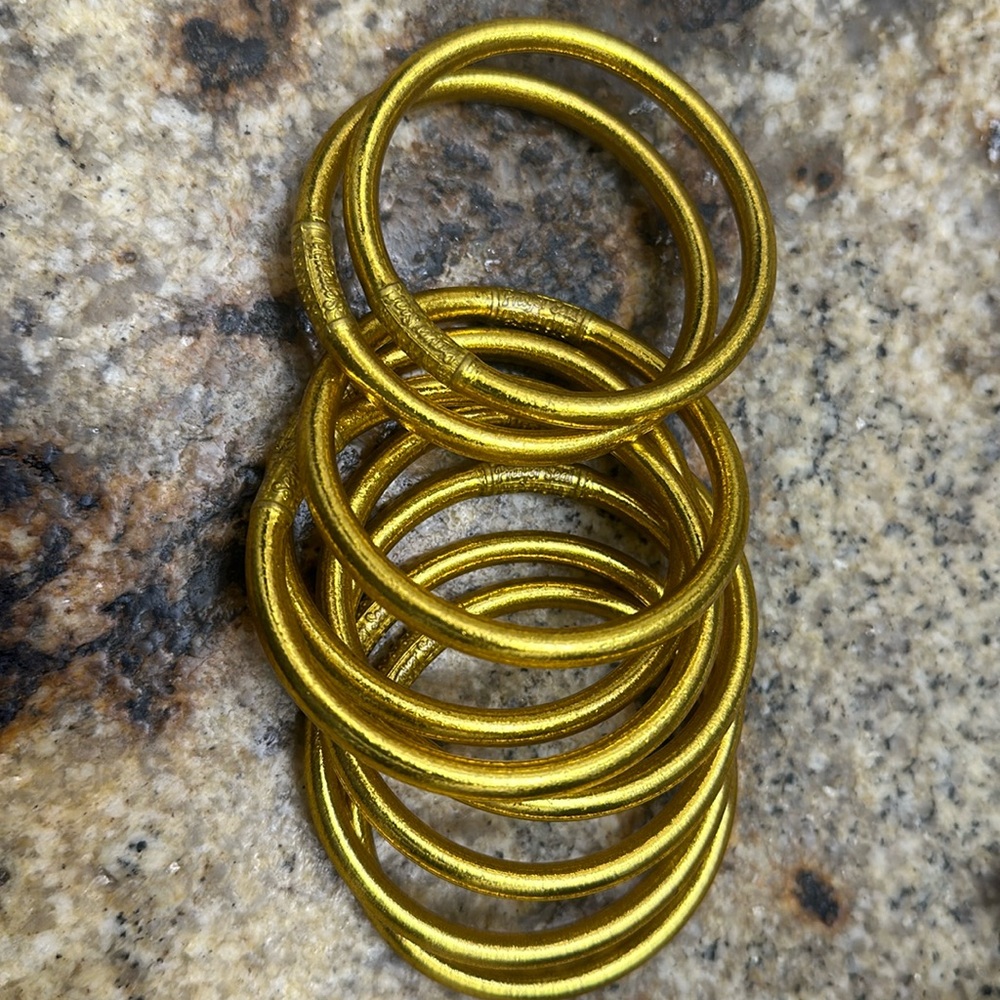 Worn twice, gold all weather bangle by Buddha Girl (9count) size small